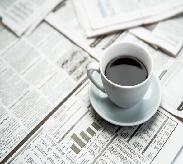 coffee on newspapers - carpetilenet