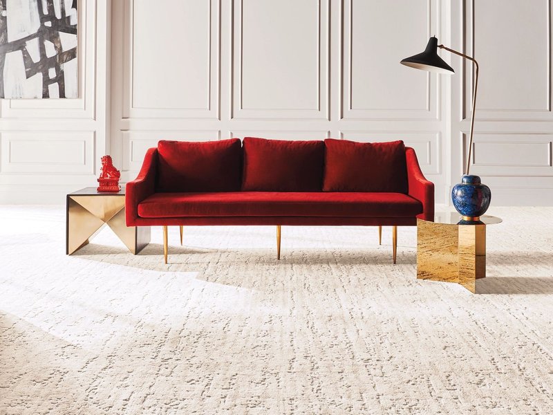 red sofa on carpet - carpetilenet